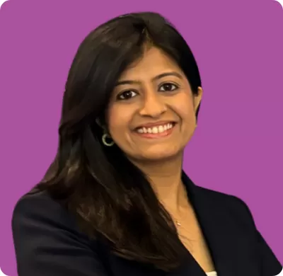 Corporate headshot of a woman on a dark pink background