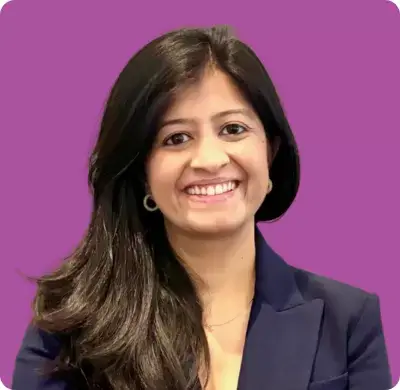 Corporate headshot of a woman on a dark pink background
