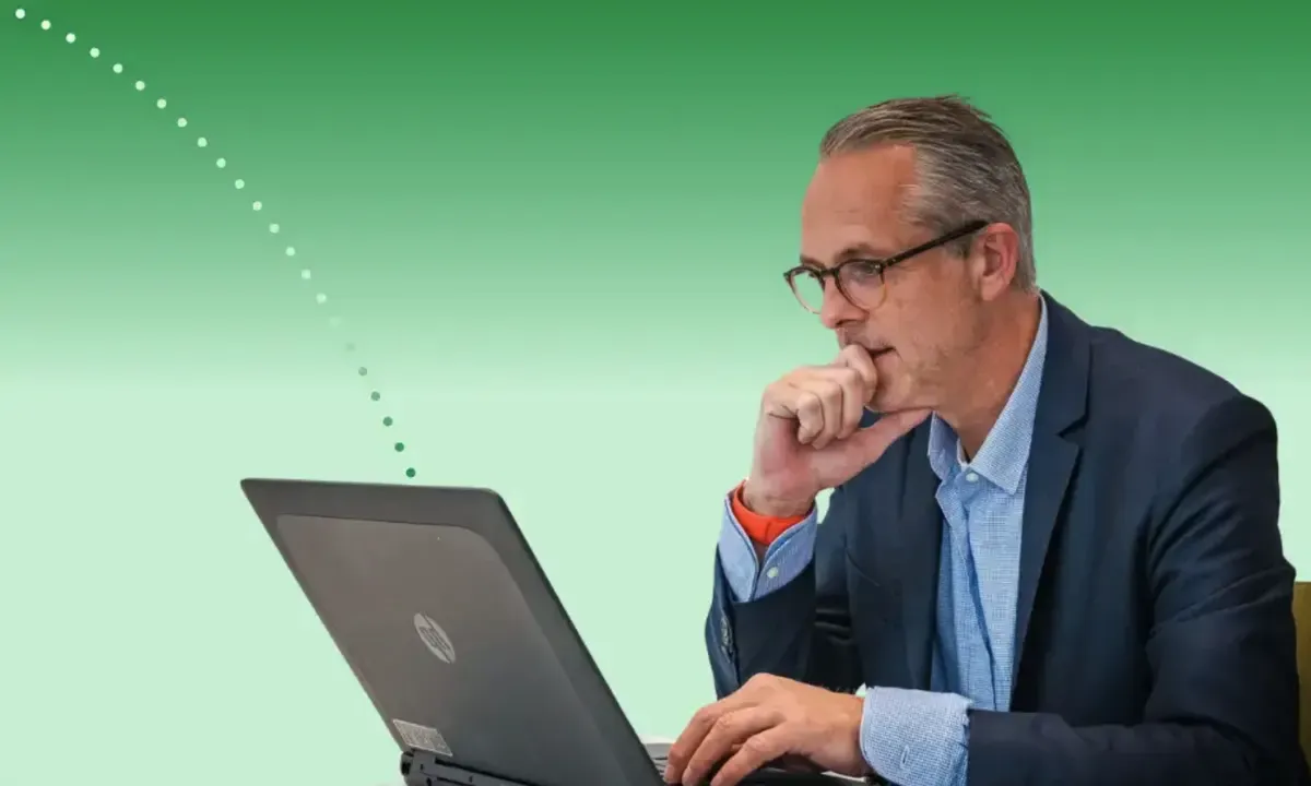 Pharma marketing leader reviewing campaign results on a laptop